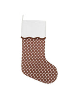 Brown patterned Christmas stocking with white cuff on a white background