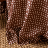 Trudie Constance Chocolate Round Tablecloth with Ruffle up close image of the ruffle edge