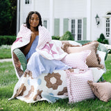 Trudie Constance Chocolate Ruffled Lumbar Pillow styled with quilts and pillows