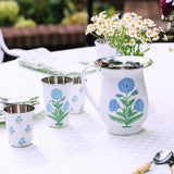 Trudie Floral Blue Short Enamelware Tumblers - Set of 4 styled on a table