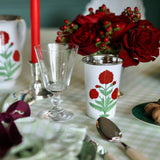Trudie Red Poppy Tall Enamelware Tumblers - Set of 4 up close styled on a table